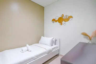 a white room with a bed and a wall at TRPS - Act Towers, Downtown Dubai - Full Burj Khalifa View, High-End 3BR plus Maids in Dubai