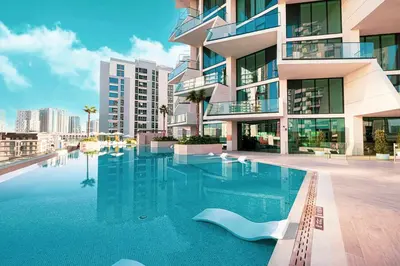 a swimming pool in front of a building at Iconic Binghatti Royale! Private Pool in Your Balcony! 5 Star Amenities! in Dubai