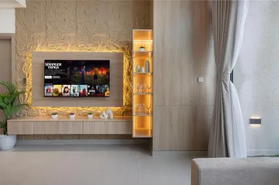 a living room with a tv on a wall at Iconic Binghatti Royale! Private Pool in Your Balcony! 5 Star Amenities! in Dubai