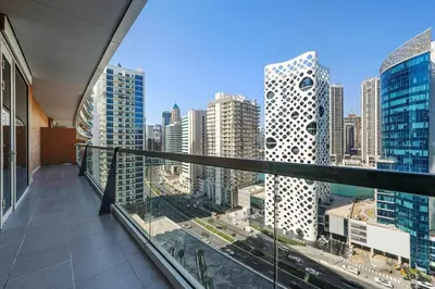 a balcony with a view of a city at Modern Smart & Spacious 1BR Business Bay near Downtown Dubai in Dubai