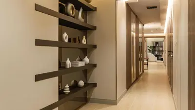 a hallway with black shelves on the wall at Maison Privee - Ultimate Luxury Penthouse with Pool & Marina Views in Dubai