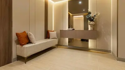 a waiting room with a couch and a mirror at Maison Privee - Ultimate Luxury Penthouse with Pool & Marina Views in Dubai