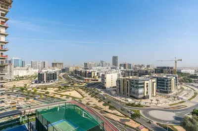 a view of a city with buildings and a street at Modern Studio Near Miracle Garden & Dubai Hills in Dubai