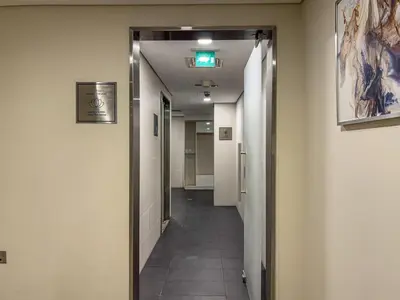 a hallway in an office building with a hallway leading to a room at Savis Homes - Luxury Studio in Business Bay with Amazing Pool - Capital Bay Tower A in Dubai