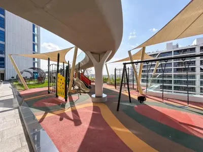 a playground with a slide on a building at Brand New Home with Amazing Facilities in Dubai