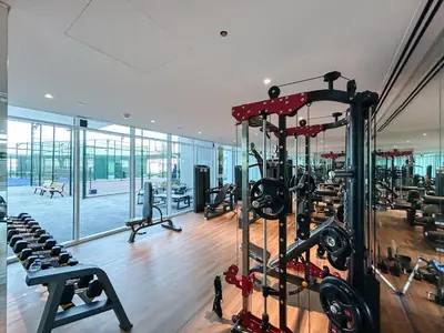a gym with treadmills and machines in a building at Brand New Home with Amazing Facilities in Dubai
