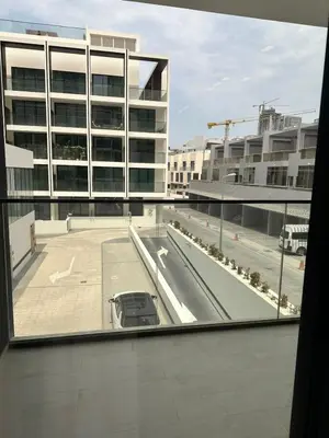 a view of a parking lot from a window of a building at Binghatti galaxy in Dubai