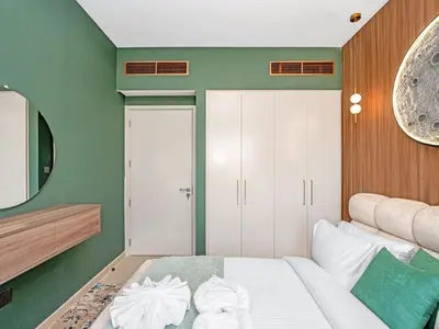 a bedroom with a white bed and a mirror at 4BR Villa in Resort-Style Gated Community with Lazy River in Arabian Ranches 3 in Dubai