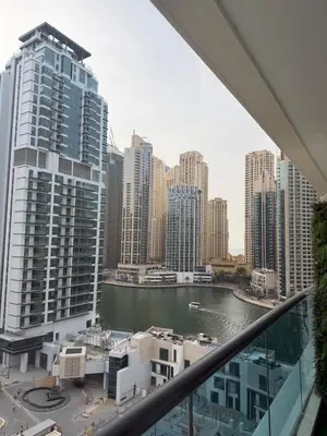 a view of a city from the balcony of a building at Marina 1 Bedroom appartment in Dubai