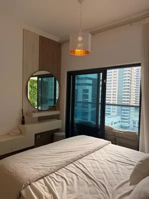 a bedroom with a large bed and a mirror at Marina 1 Bedroom appartment in Dubai