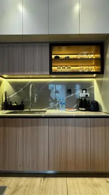 a kitchen with a sink and a counter top at Brand New 1BDR with Pool, Jacuzzi, Sauna, Gym in Dubai