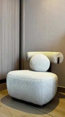a ottoman sitting on the floor in a room at Brand New 1BDR with Pool, Jacuzzi, Sauna, Gym in Dubai