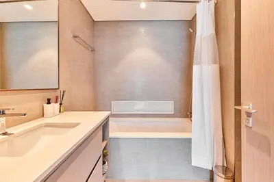 a bathroom with a tub and a sink and a shower at GRaNDE 2BR Best BURJ Khalifa & Fountain, Next to DXB Mall in Dubai