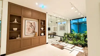 a large room with a large wooden wall at 1-Bedroom Apartment - Burj Khalifa -Water View in Dubai