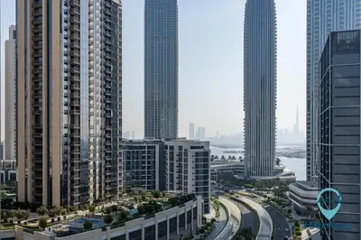 a view of a city with tall buildings and highways at Stunning 1BR l Creek Crescent Suite in Dubai