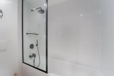 a shower with a glass door in a bathroom at 29 Boulevard-Burj Khalifa View-Downtown Dubai-Lit Apartment in Dubai
