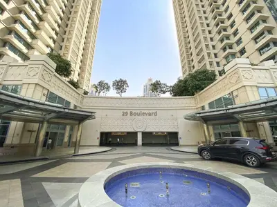 a building with a car parked in front of it at 29 Boulevard-Burj Khalifa View-Downtown Dubai-Lit Apartment in Dubai