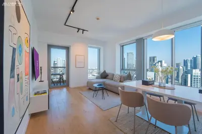 a living room with a couch and a table at 29 Boulevard-Burj Khalifa View-Downtown Dubai-Lit Apartment in Dubai