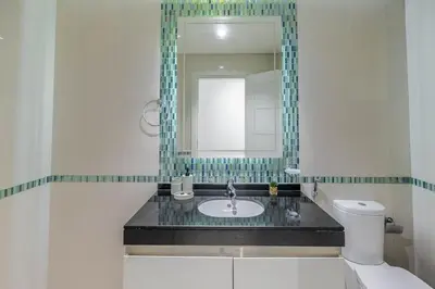 a bathroom with a sink and a mirror at Luxe Living At Damac heights - Dubai Marina - Marina & Sea Views in Dubai
