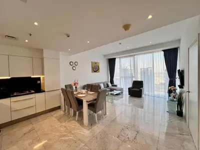 a kitchen and living room with a table and chairs at Luxury 1BR near Burj Khalifa Business Bay Free Parking in Dubai