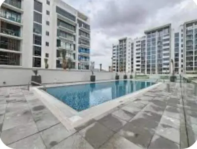 a swimming pool in the middle of a building at Luxury Studio big Balcony in Dubai