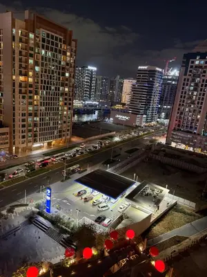 a view of a city at night with traffic at Mag318 downtown Luxury-5 Minutes walk to Burj&mall in Dubai