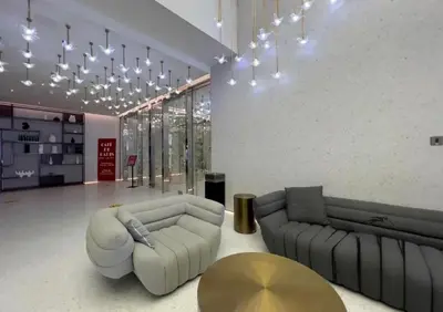 a large living room with a couch and a table at Mag318 downtown Luxury-5 Minutes walk to Burj&mall in Dubai