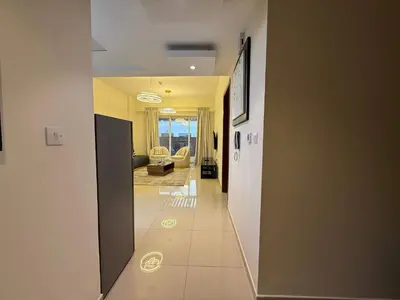 a hallway with a view of a living room at Comfort Focused 1BR Laya JVC in Dubai