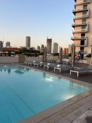 a large swimming pool on the roof of a building at The Residences in Dubai