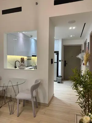 a dining room with a table and a chair at The Residences in Dubai