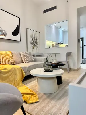 a living room with a couch and a table at The Residences in Dubai