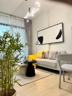 a living room with a couch and a table at The Residences in Dubai