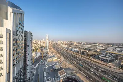 an overhead view of a city with buildings and trains at Brand-New Elegant Stay Premium Amenities JVT in Dubai