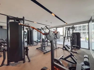 a gym with lots of equipment in a building at Luxury 1BHK Apartment Nobles Tower, Business Bay in Dubai