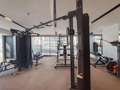 a room with a gym with equipment in it at Luxury 1BHK Apartment Nobles Tower, Business Bay in Dubai