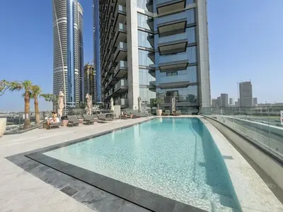 a swimming pool in the middle of a building at Luxury 1BHK Apartment Nobles Tower, Business Bay in Dubai