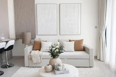 a living room with a white couch and a table at Luxury 1BR Haven W Private Pool - Binghatti Royale in Dubai