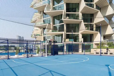 a rendering of a tennis court in front of a building at Luxury 1BR Haven W Private Pool - Binghatti Royale in Dubai