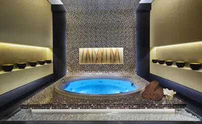 a bathroom with a jacuzzi tub in a room at Nasma Luxury stays - Executive stay with hotel facilities in Dubai