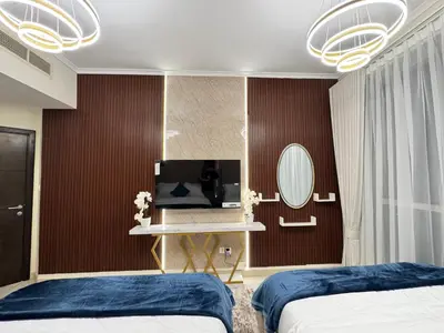 a bedroom with two beds and a mirror at Spacious 2BR Apartment-Marina Walk Luxury Stay-Enjoy Dubai Marina Views in Dubai