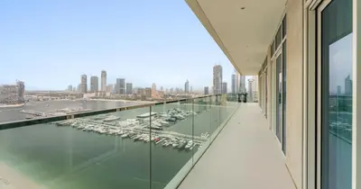 a view of a marina from the balcony of a building at Luxury 3BHK & Maid Sea View & Private Beach in Sabkhah