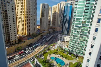 an aerial view of a city with tall buildings at Stunning 2 Bedroom Apartment in JBR with Balcony in Dubai