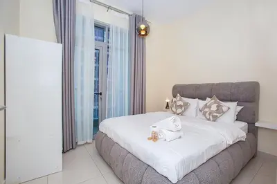 a bedroom with a bed with a towel on it at Stunning 2 Bedroom Apartment in JBR with Balcony in Dubai