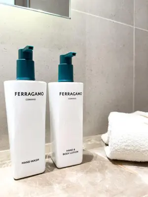 two bottles of hygiene products sitting on a bathroom counter at Luxe Apt with Private Balcony Pool in Dubai