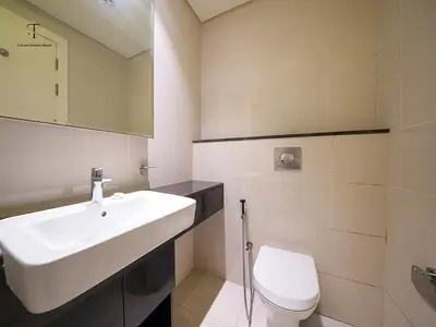 a bathroom with a white sink and a toilet at Golden Grove 1 Bhk Bays Edge 1 Business bay in Dubai
