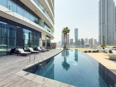 a swimming pool on the side of a building at Golden Grove 1 Bhk Bays Edge 1 Business bay in Dubai