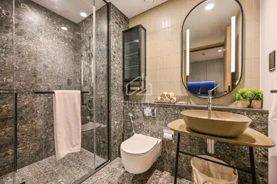 a bathroom with a sink and a shower at Stylish Studio with views of pool & Burj Khalifa in Dubai