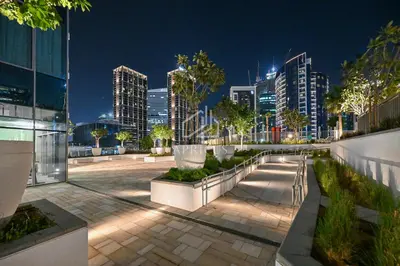 a city skyline at night with tall buildings at Stylish Studio with views of pool & Burj Khalifa in Dubai