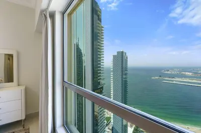 a view of the ocean from a hotel room window at Modern Upgraded 1BR - High Floor with Ocean View in Dubai
