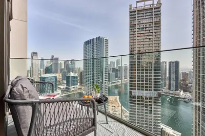 a balcony with a view of a city at Frank Porter - Peninsula One in Dubai